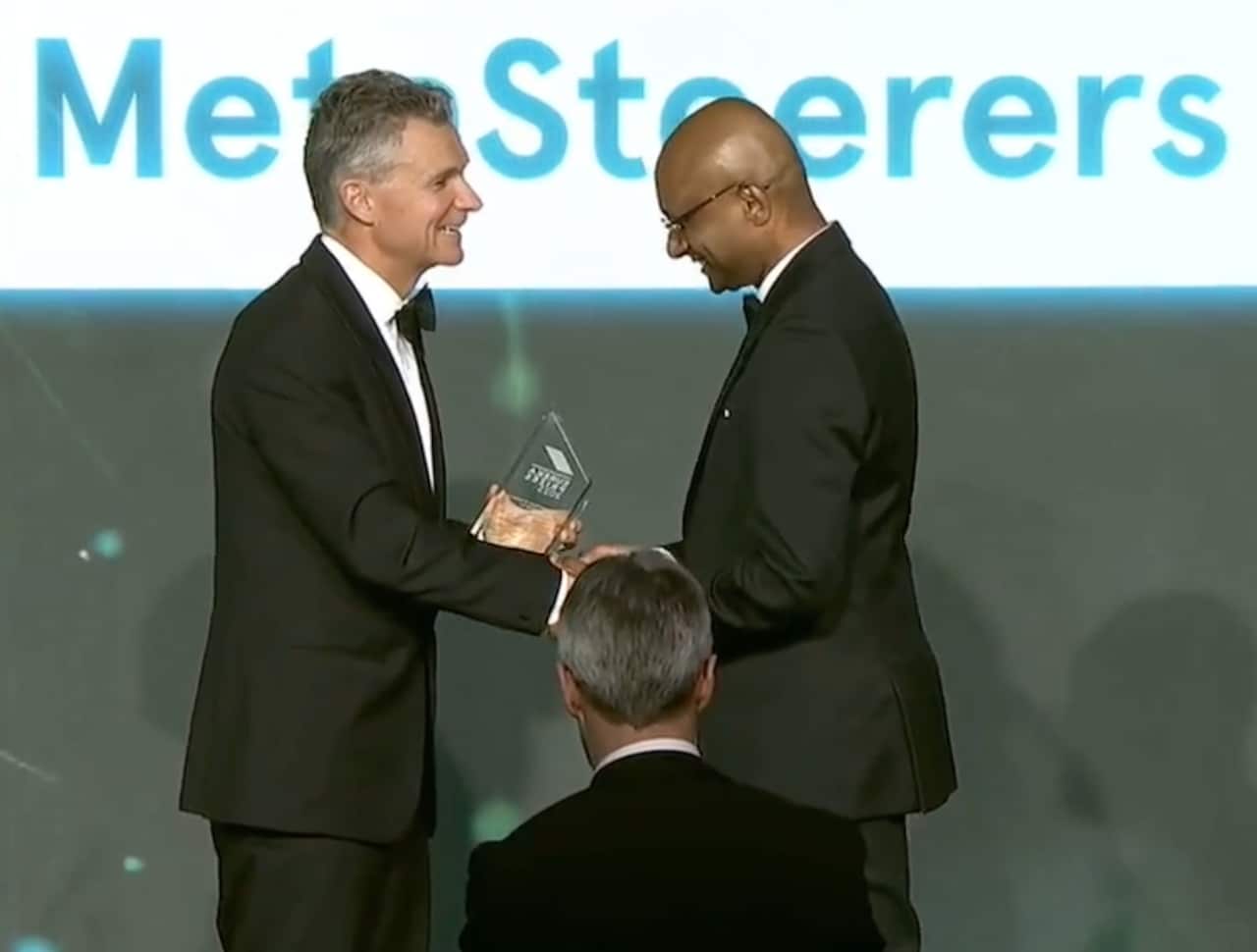 Karu receiving the Eureka trophy from the minister.png