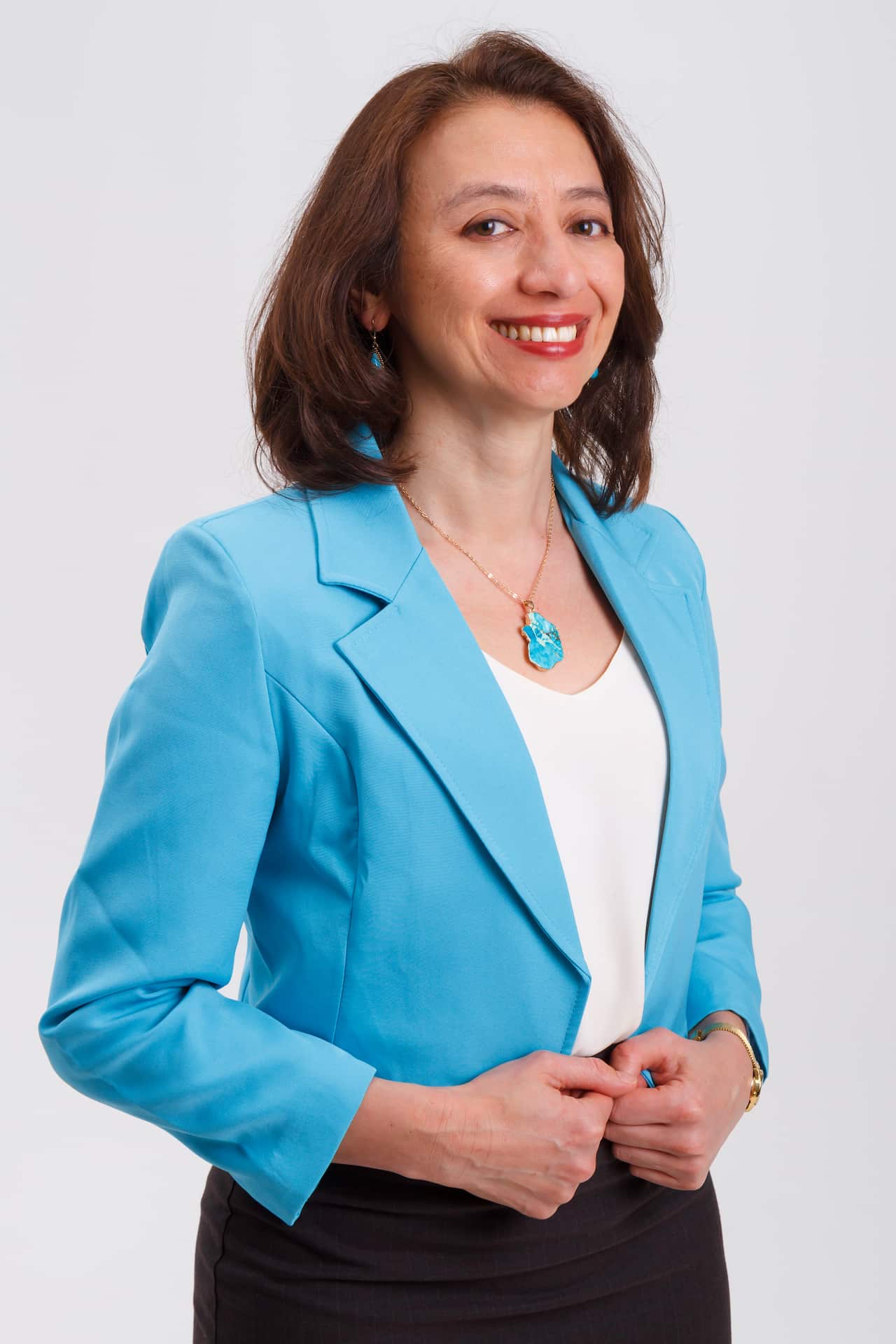 A woman wearing a blue jacket