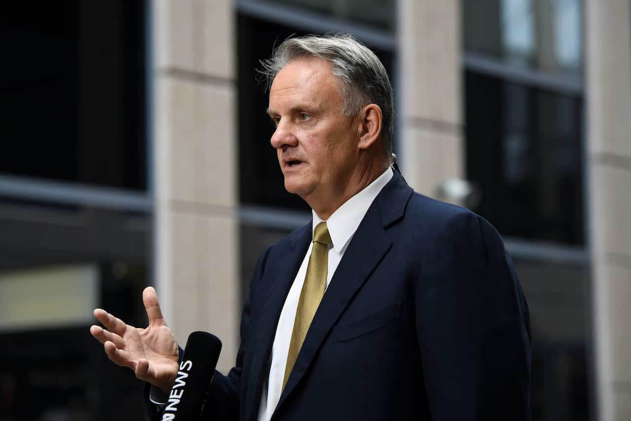 Mark Latham standing and talking into a microphone