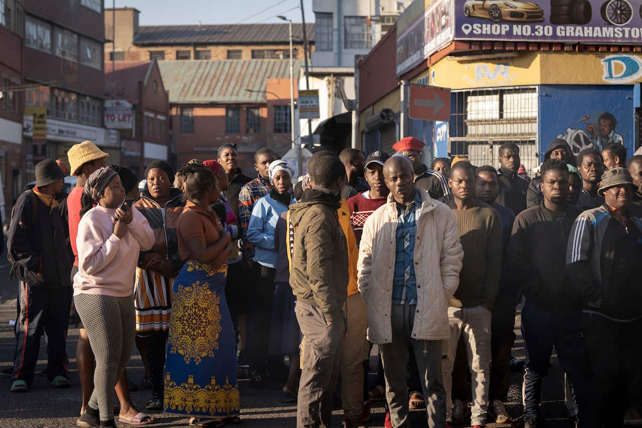 A group of people standing outside 