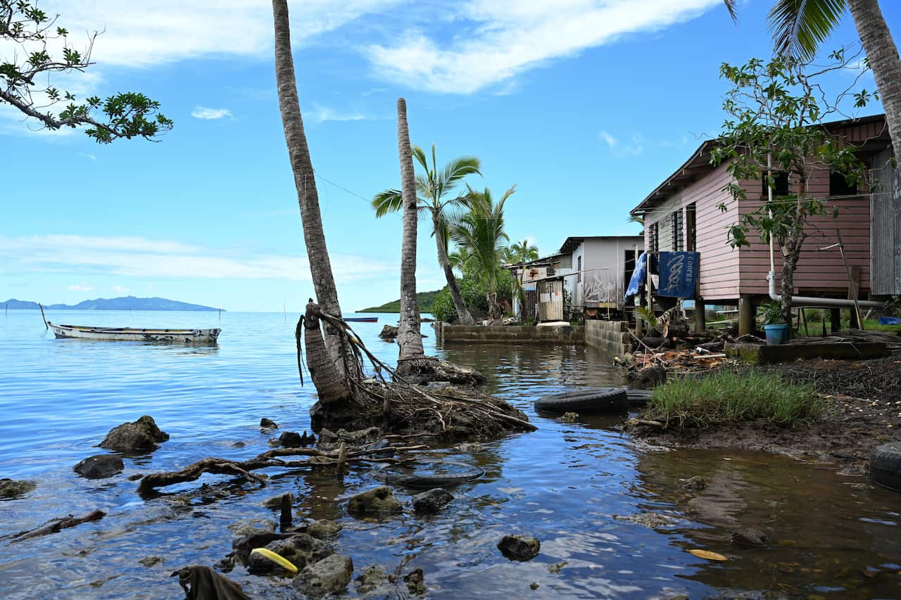 Houses in Fiji pictured next to high sea levels