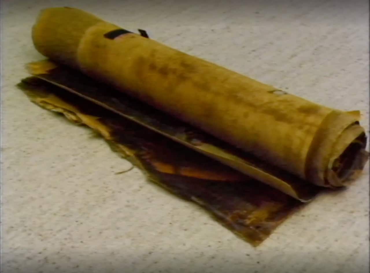 A rolled-up picture canvas