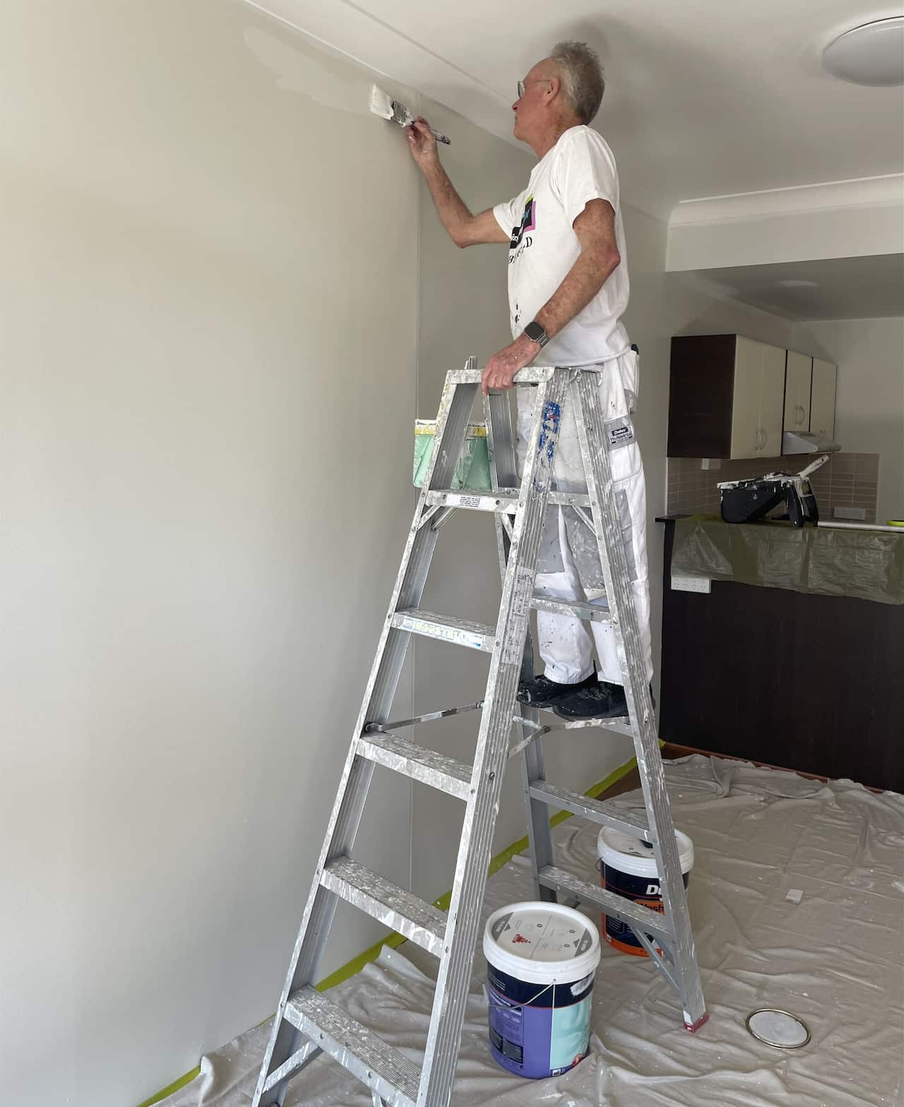 Jack Moon painting an apartment in Sydney