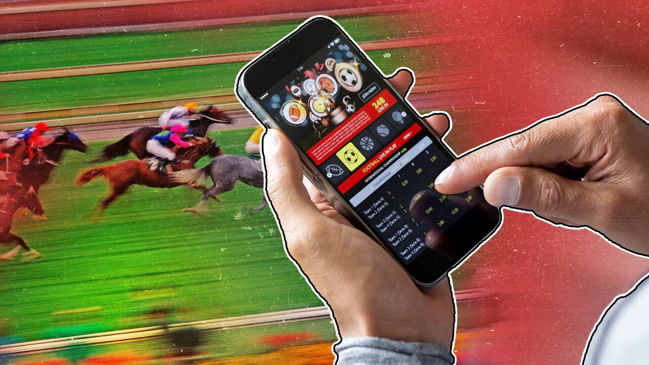 A finger hovering over a phone with a sports bet app, with horse racing in the background.