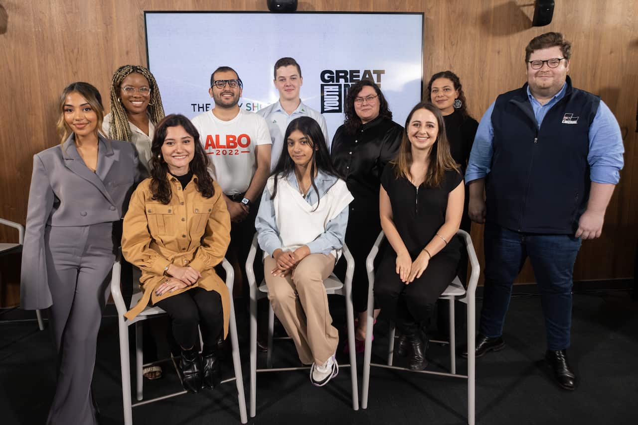 A group stands together for a photo.