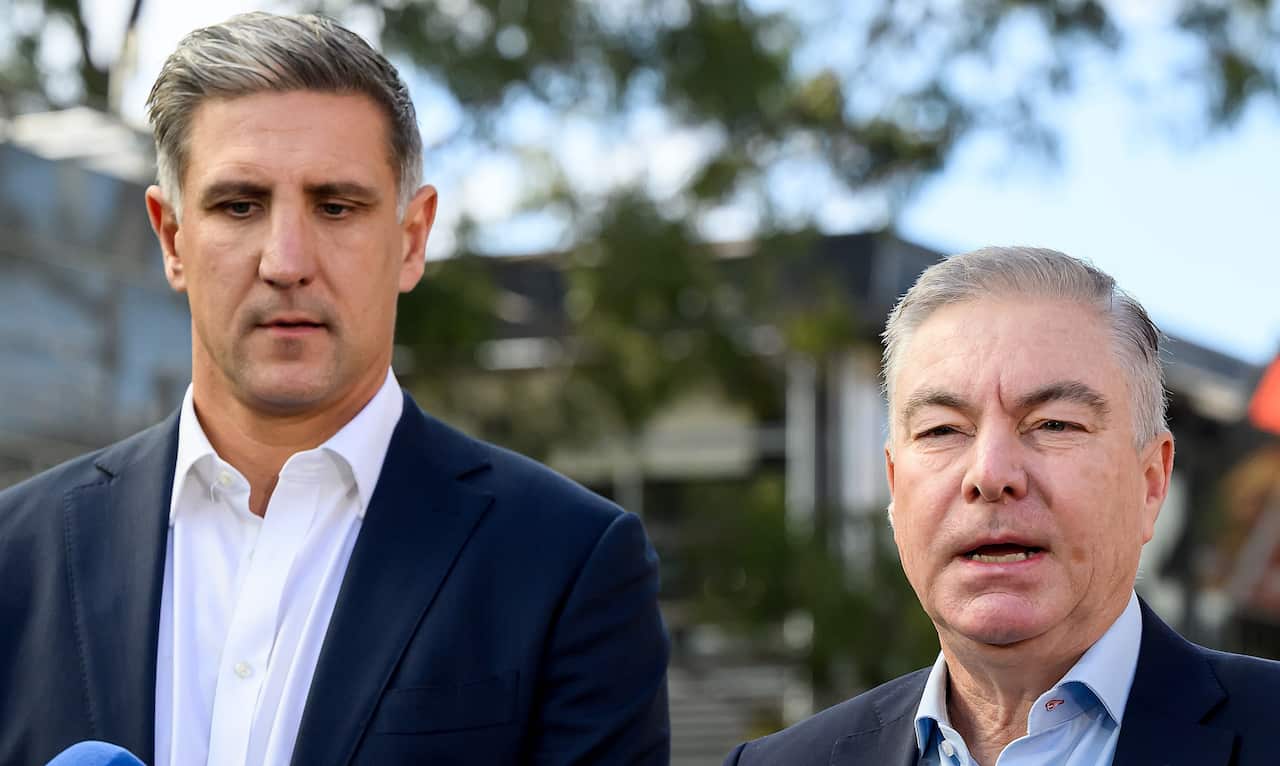 Matthew Pavlich and Andrew Pridham standing next to each other. Pridham is speaking.