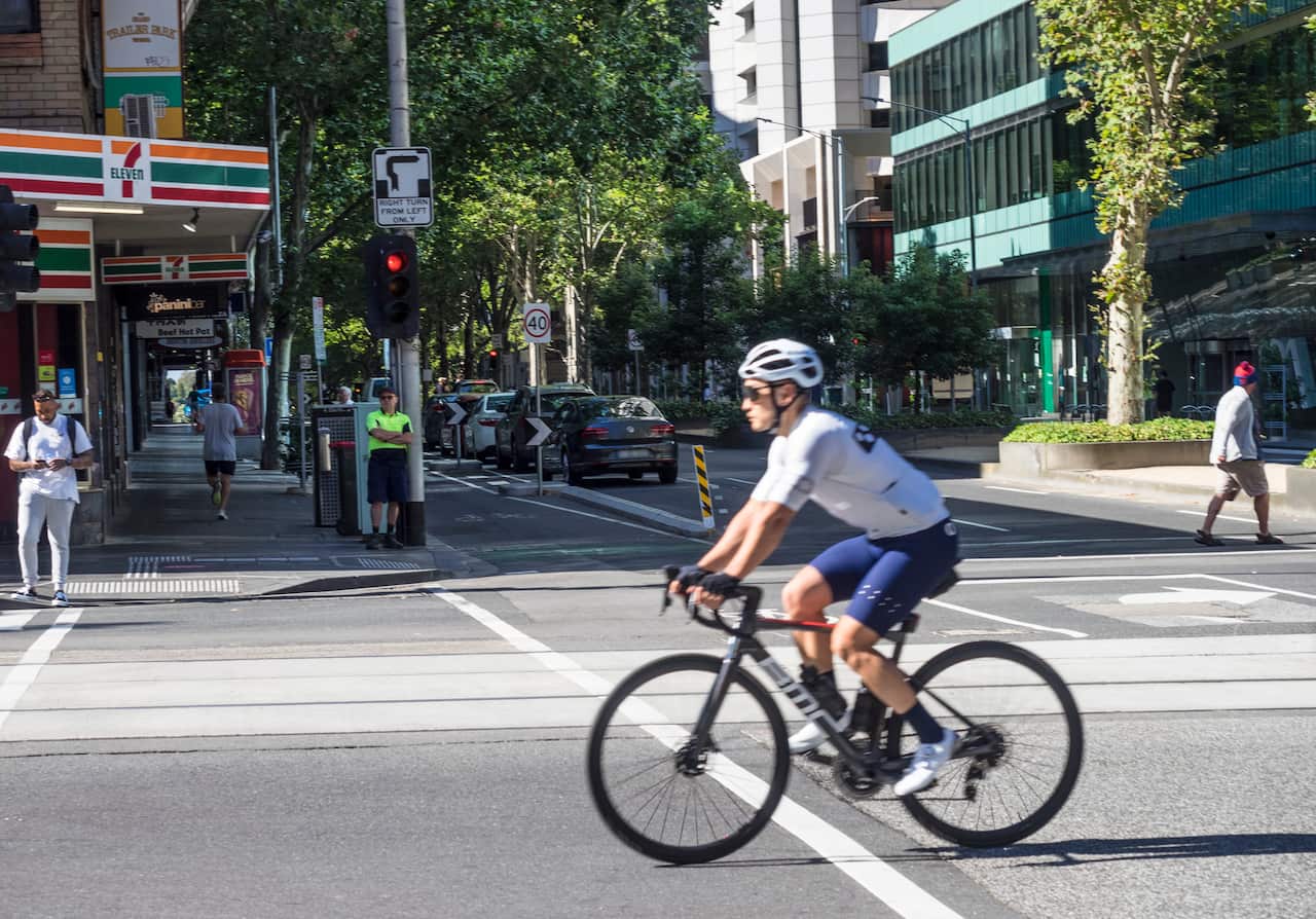Male cyclist on Bourke St Melbourne