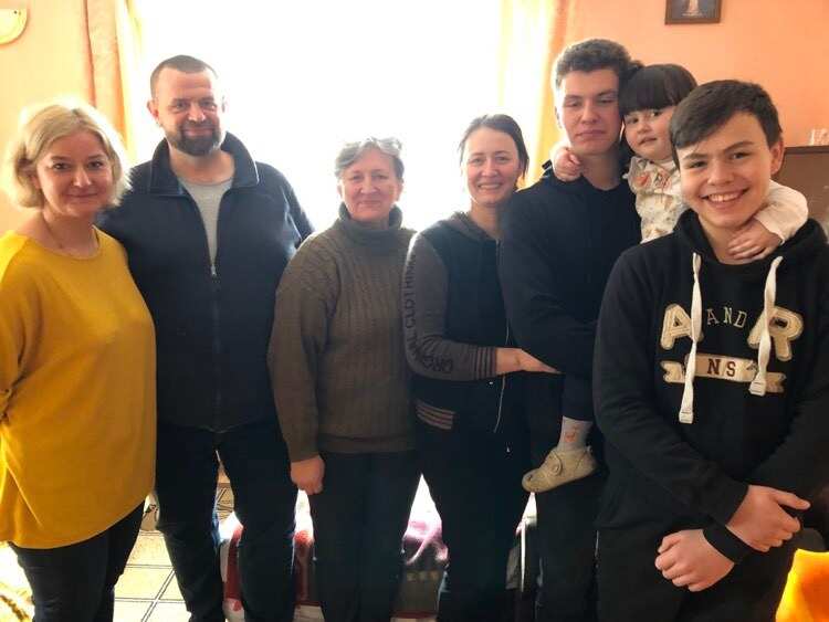 Polish couple Ewa and Maciej Gamanda (left) and the Ukrainian family they are housing near the border.
