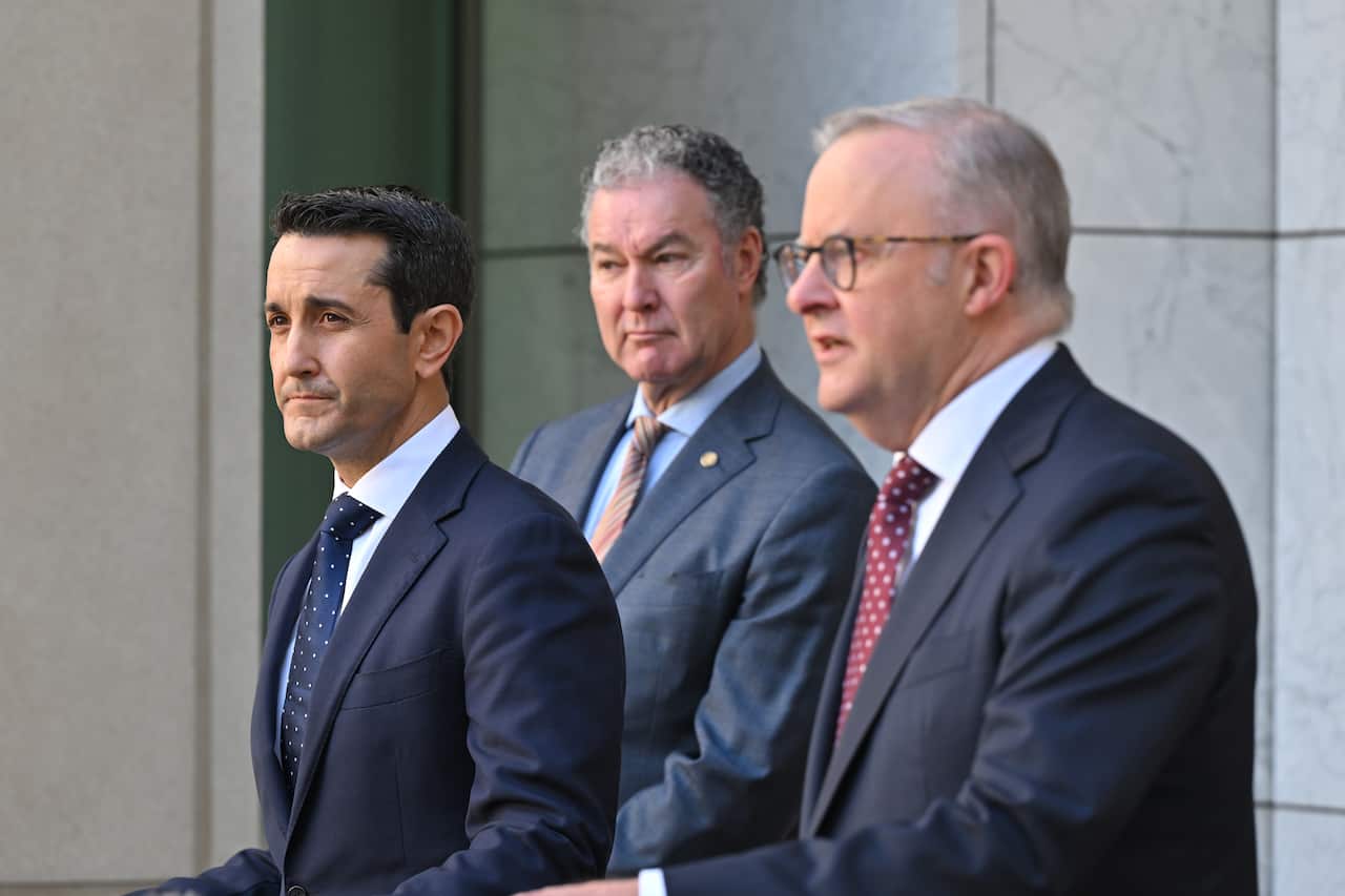 David Crisafulli, John-Paul Langbroek and Anthony Albanese wearing suits and speaking at a press conference