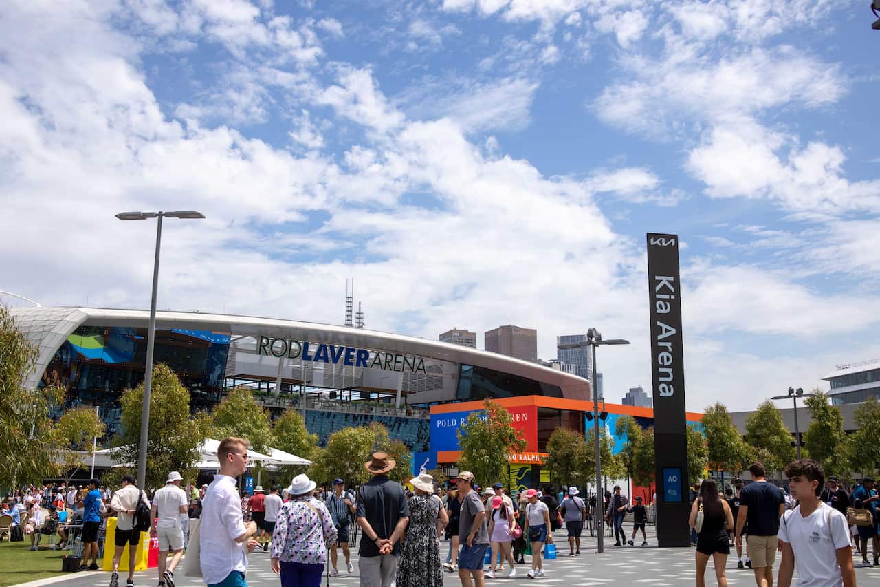 People outside a tennis stadium