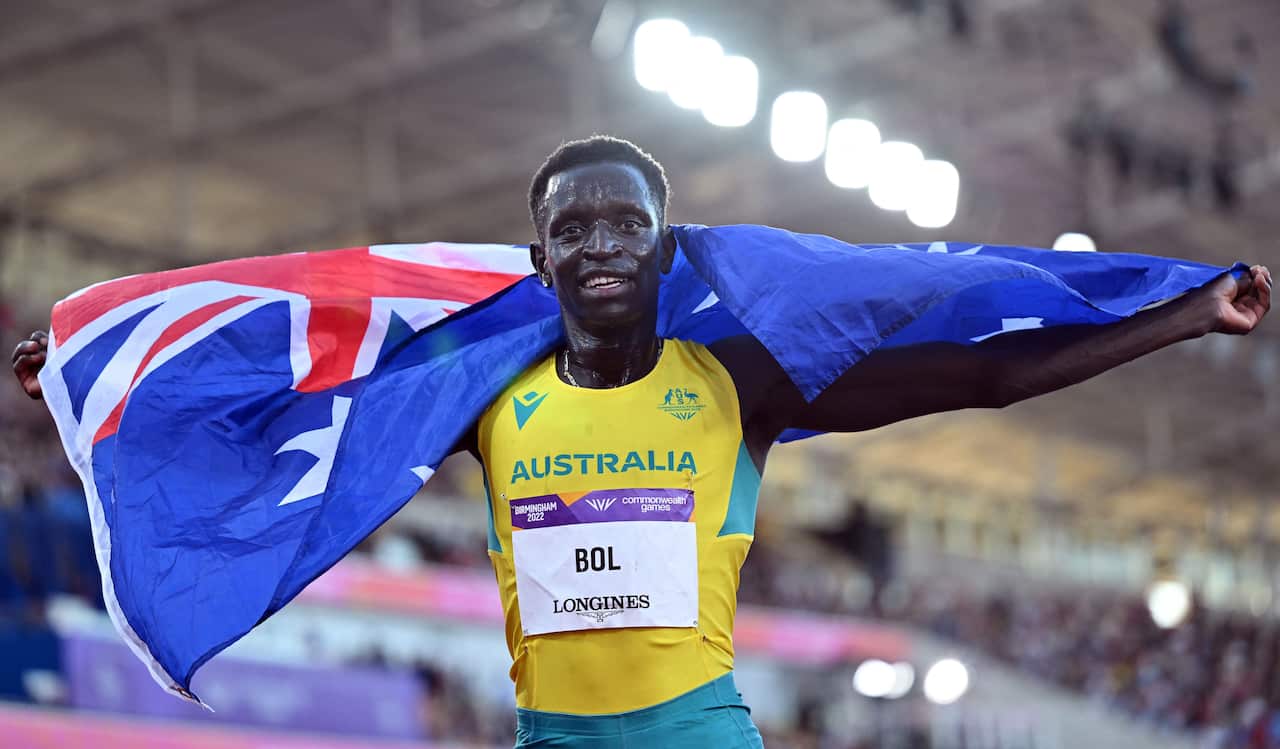 A runner waving the Australian flag.