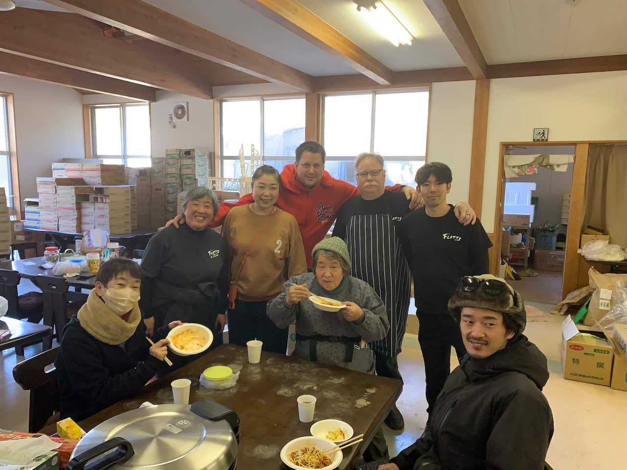 Chikako (second from the left), Benjamin (third from the right) and their staff cooking for neighbor after Noto Peninsula Earthquake that occurred 1st January 2024