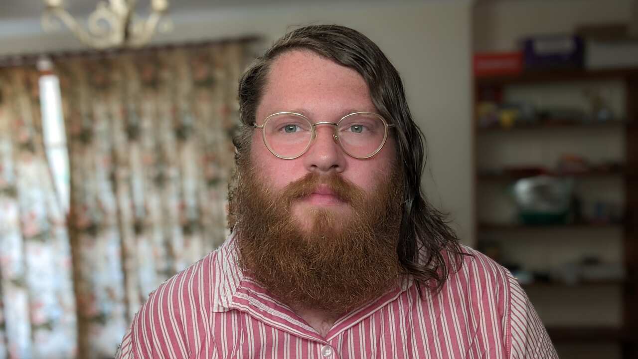 Man wearing glasses looking at camera