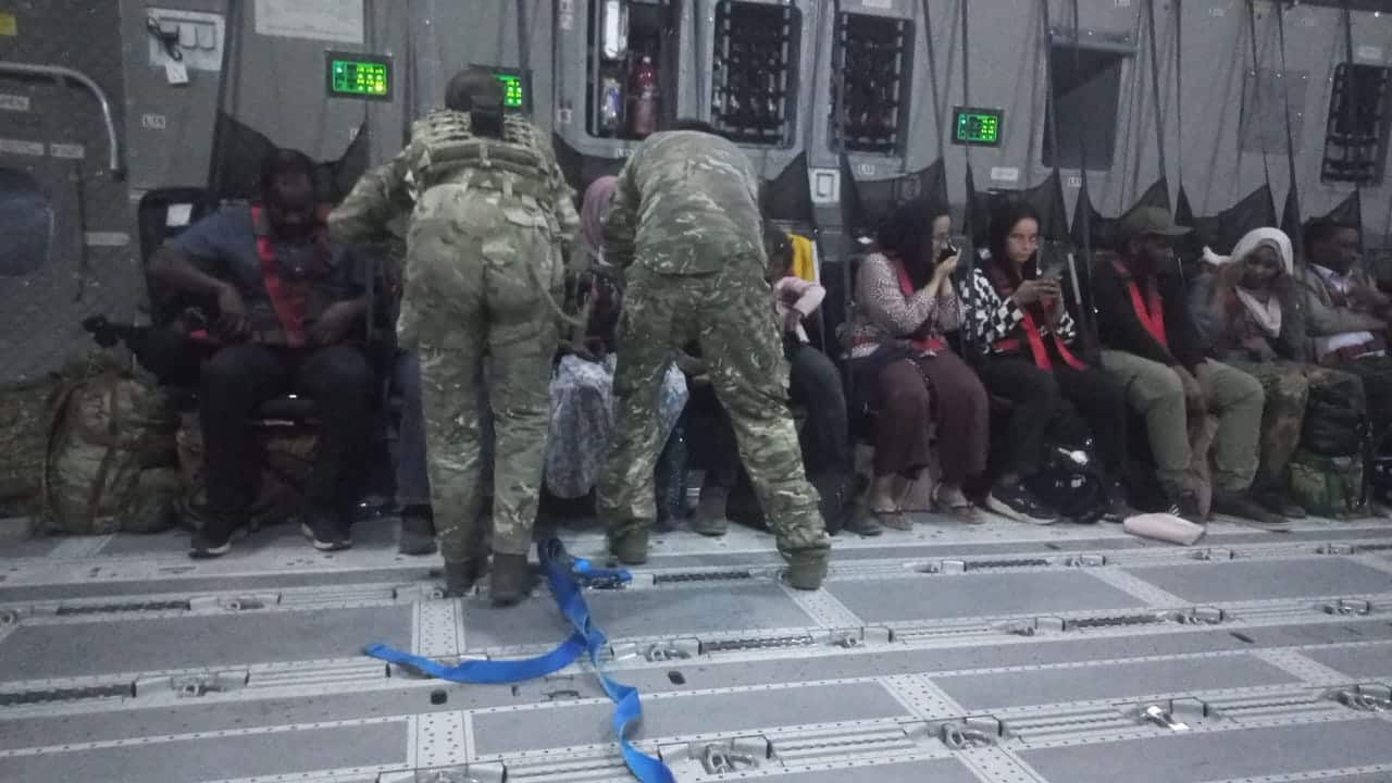People on an airforce plane