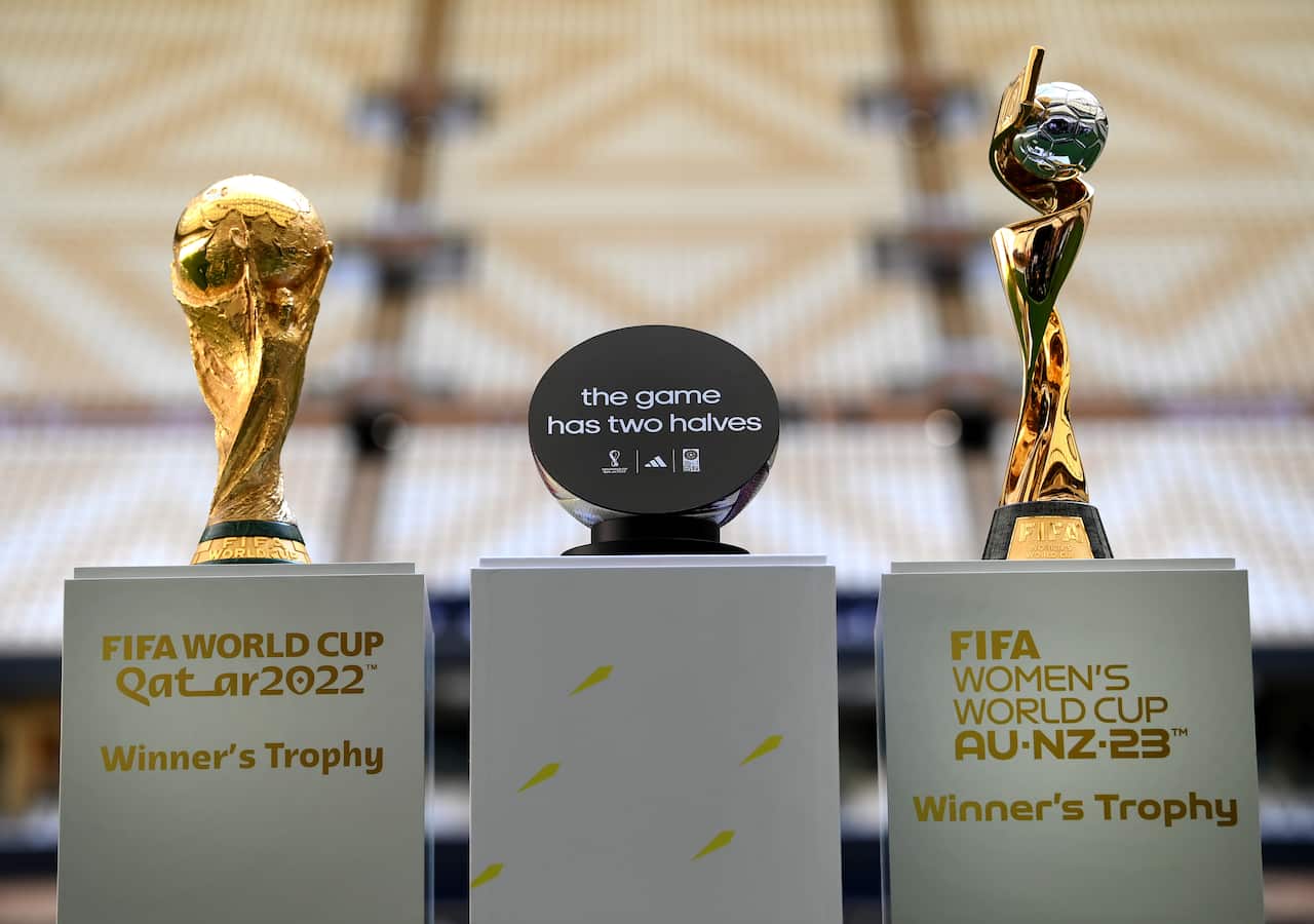 Two trophies - the men's and the women's - on display together.