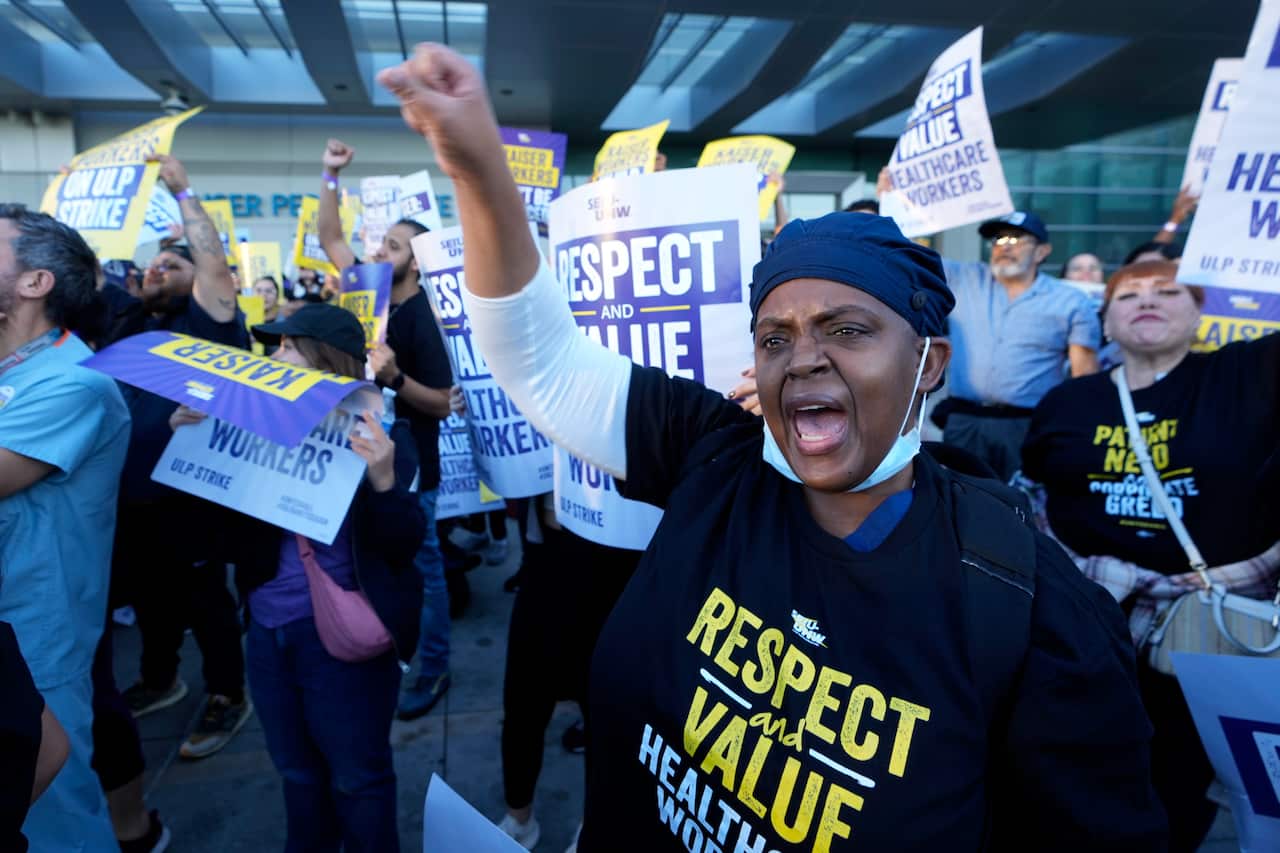A group of protesters holding up signs.