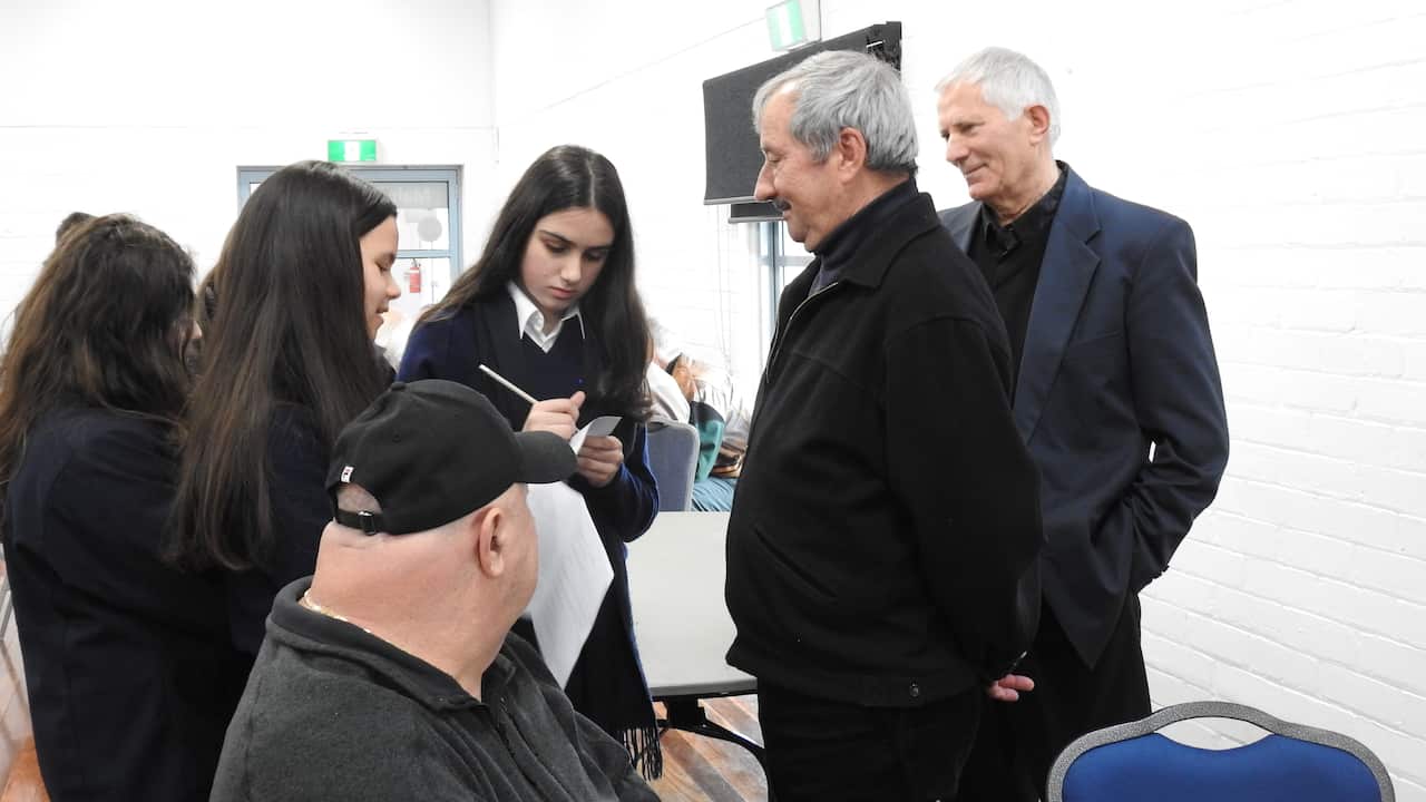 Students talks with pensioner.jpg