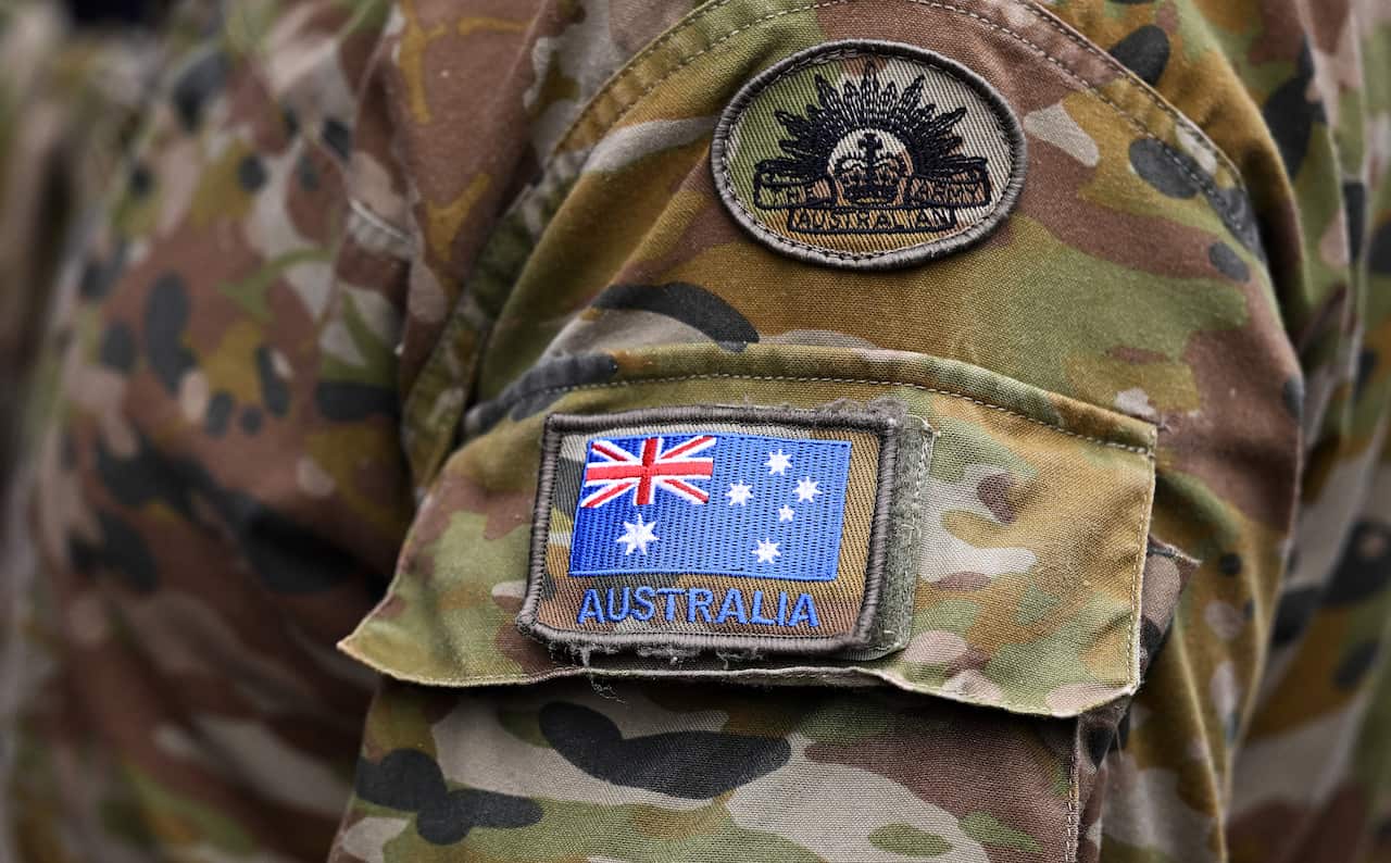 Detail of an Australian flag pictured on the uniform of an Australian Army personnel