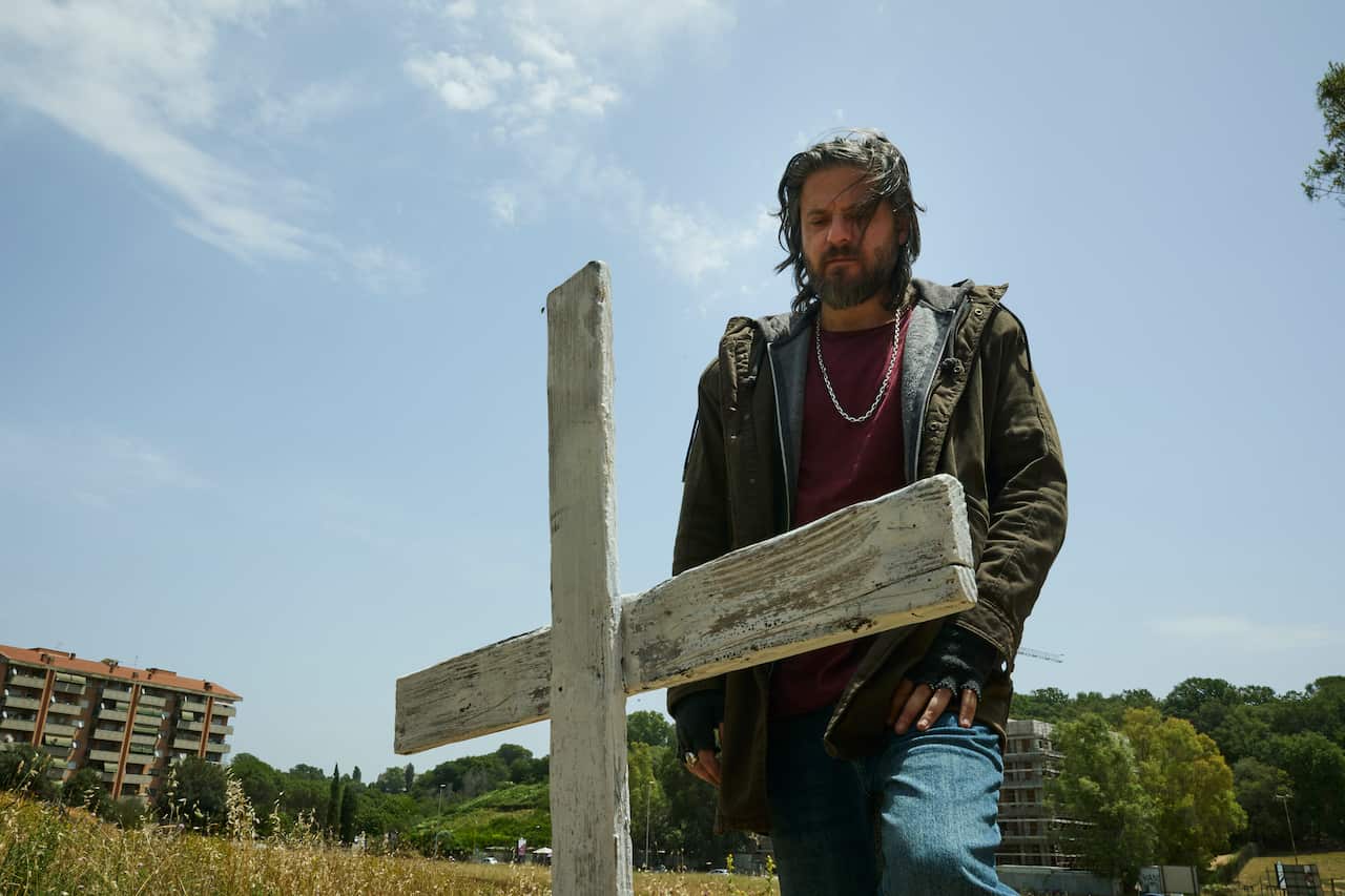 Edoardo Pesce as Christian