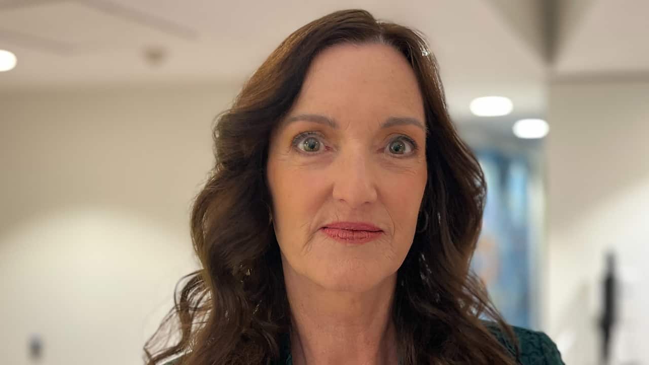 a close up of a middle aged brunette woman