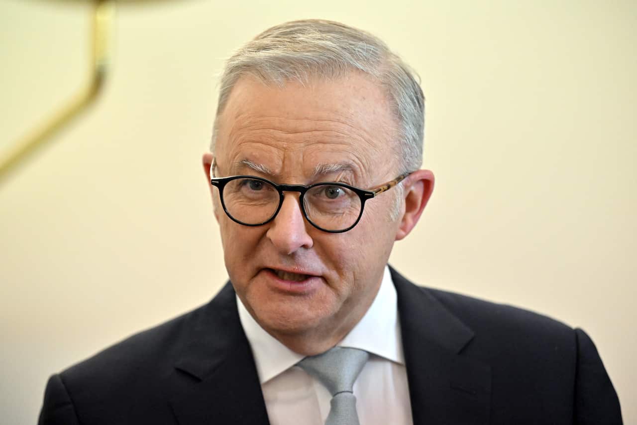 Anthony Albanese in a suit, speaking.