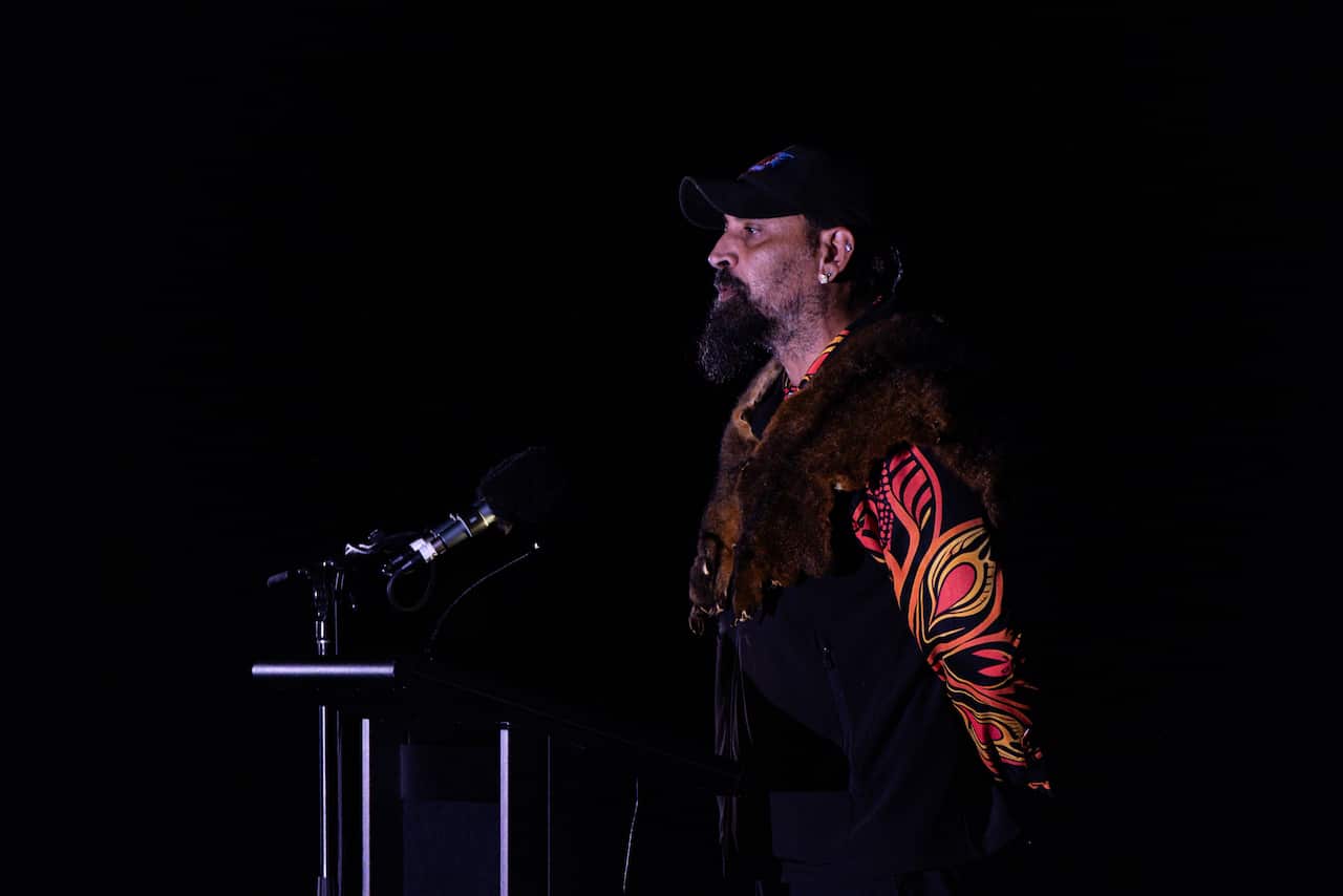 A man speaking at a podium.
