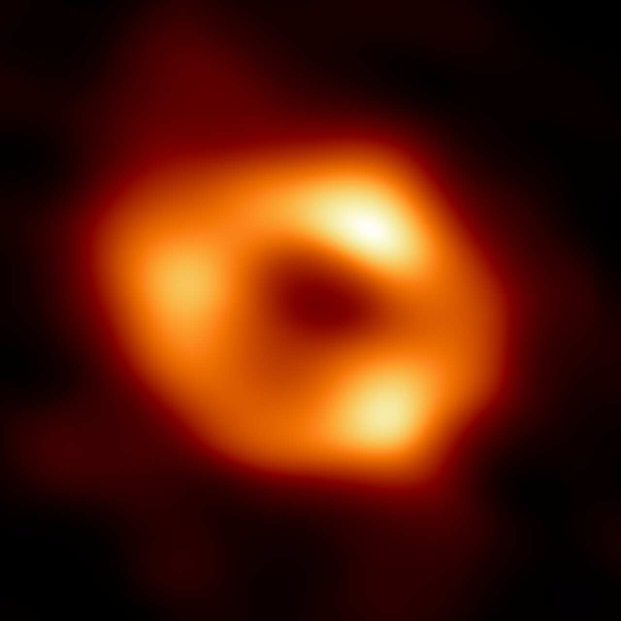 A glowing orange doughnut shape on a black background