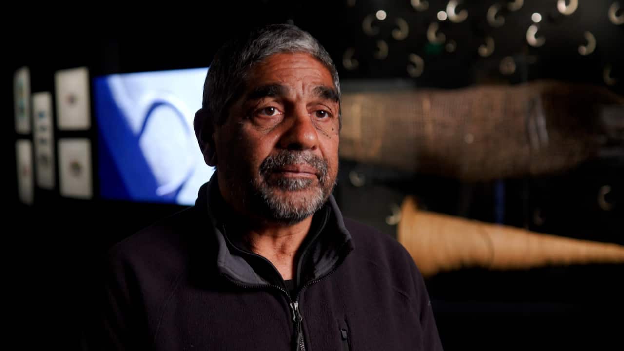 A portrait of a man looking at the camera.