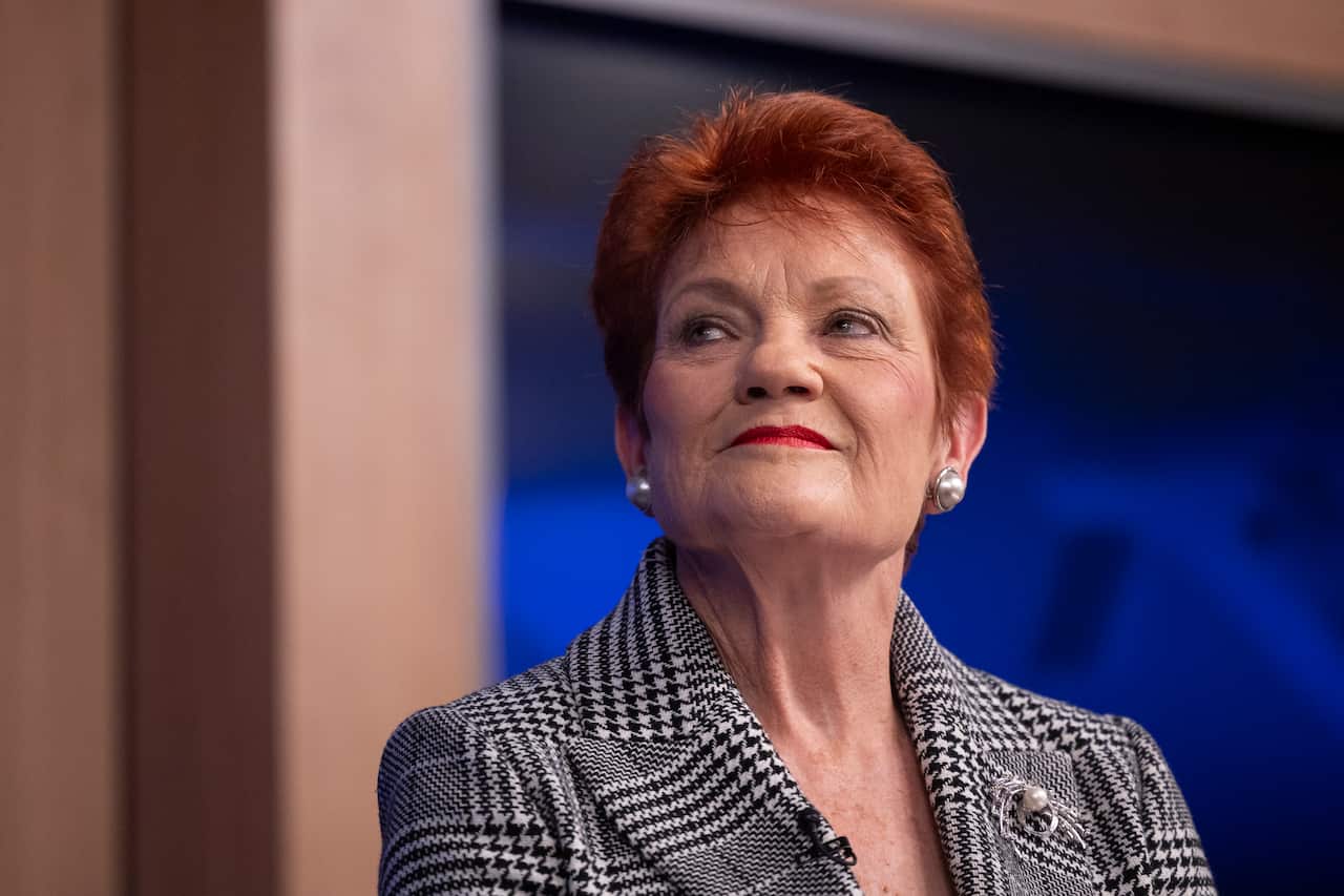 Pauline Hanson in a black and white jacket.