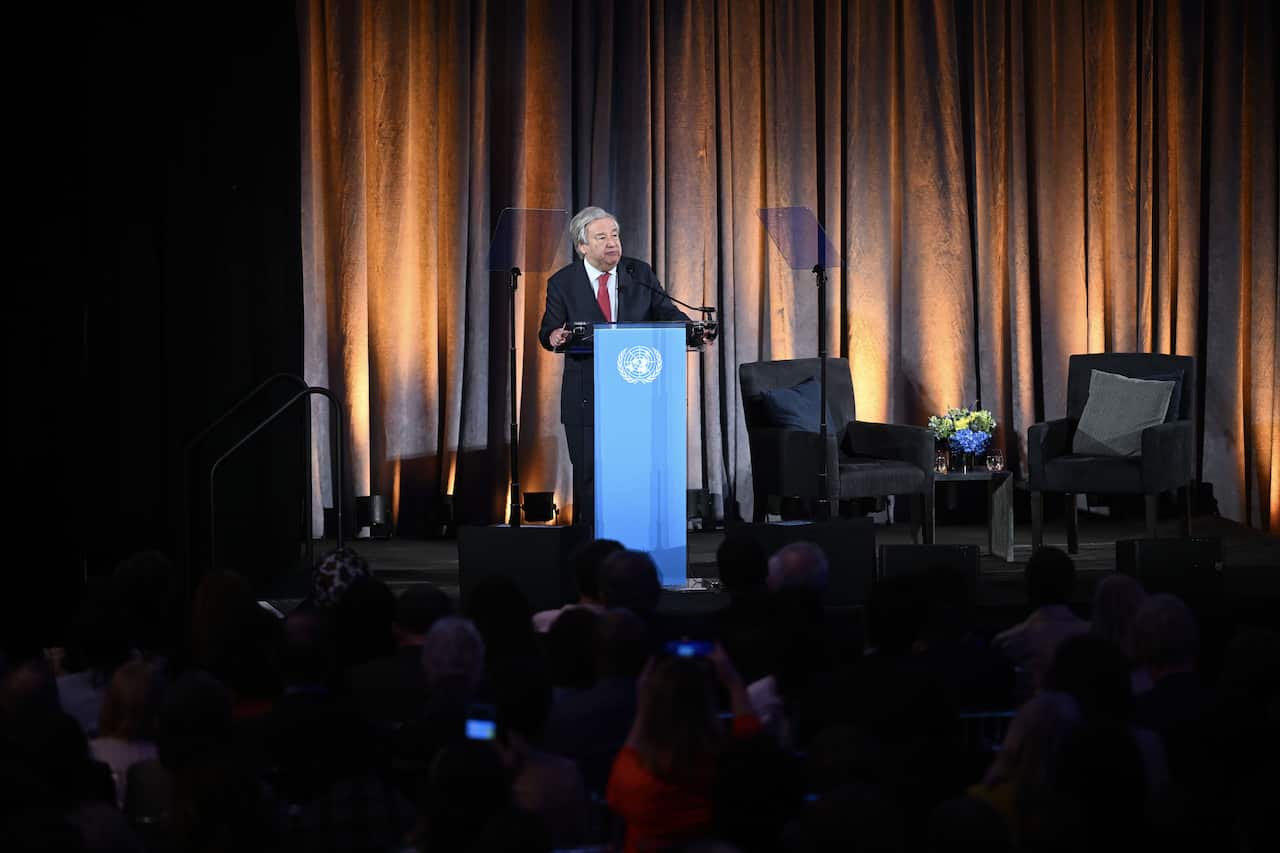 United Nations Secretary-General Antonio Guterres standing at a podium