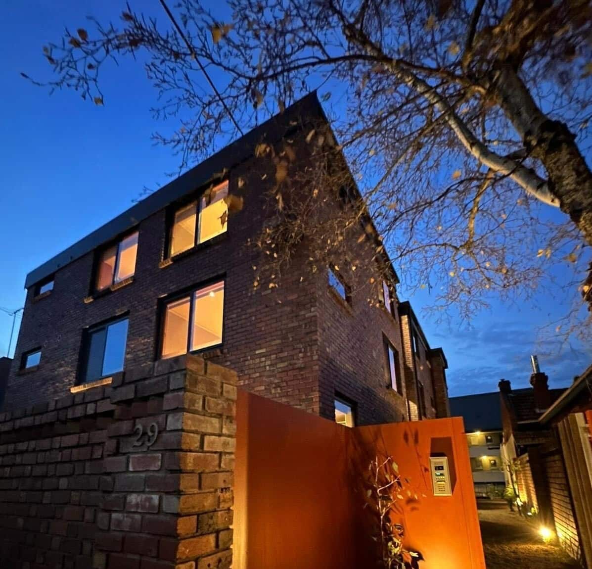 The exterior of a brick apartment block.