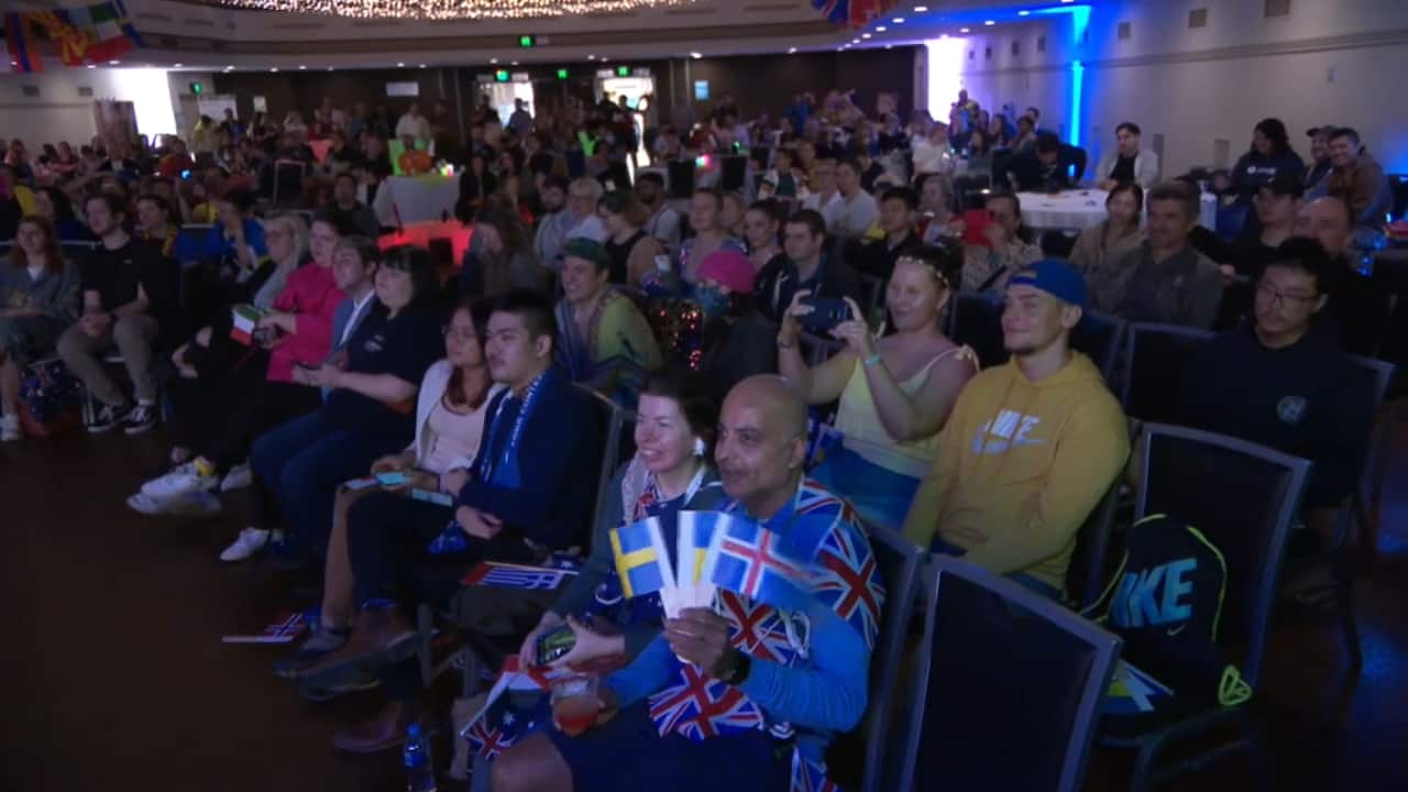 Australian Eurovision fans cheering on contestants at a live broadcast party in Hurstville, Sydney.