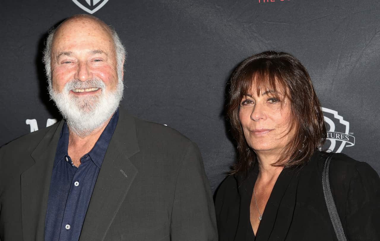 Rob and Michele Reiner in front of a black background
