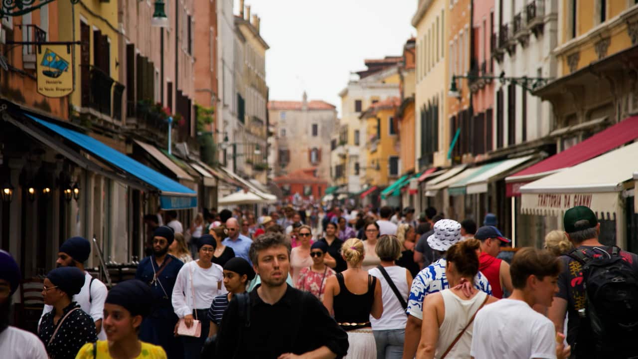 An alleyway packed with people 
