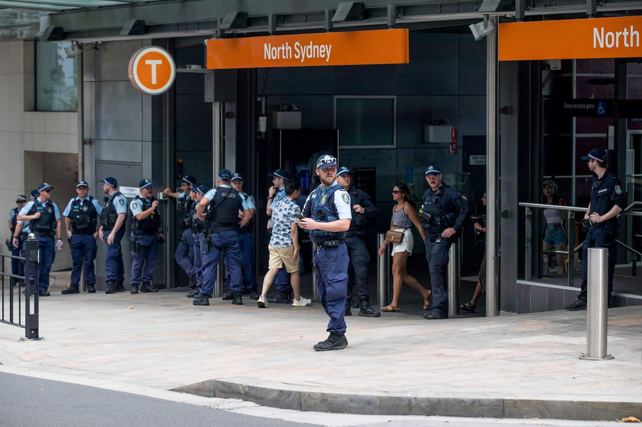A group of police officers is seen at the North Sydney train station.