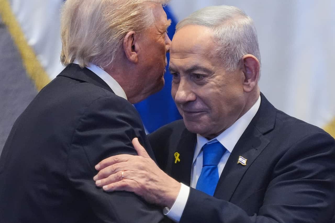 Benjamin Netanyahu embraces Donald Trump.