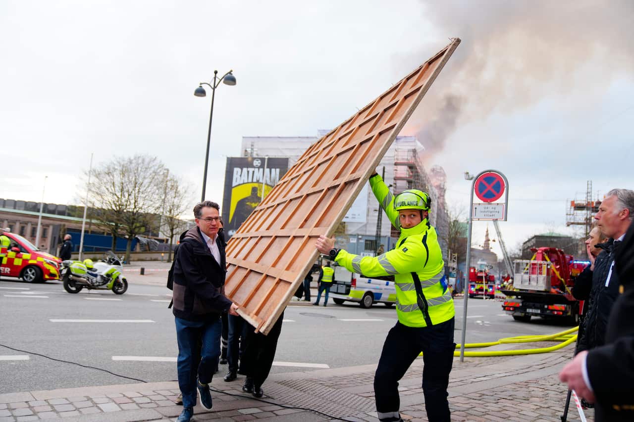 Art being carried from a burning building. 