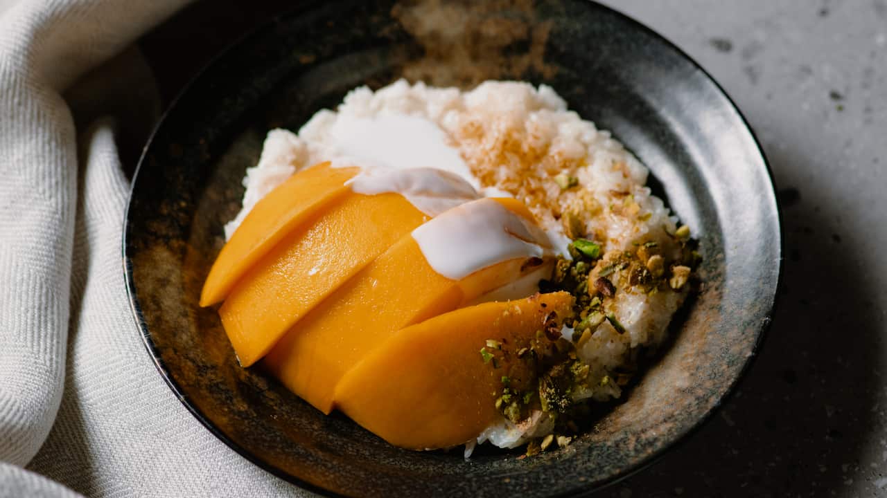 Mango sticky rice with pistachios and palm sugar