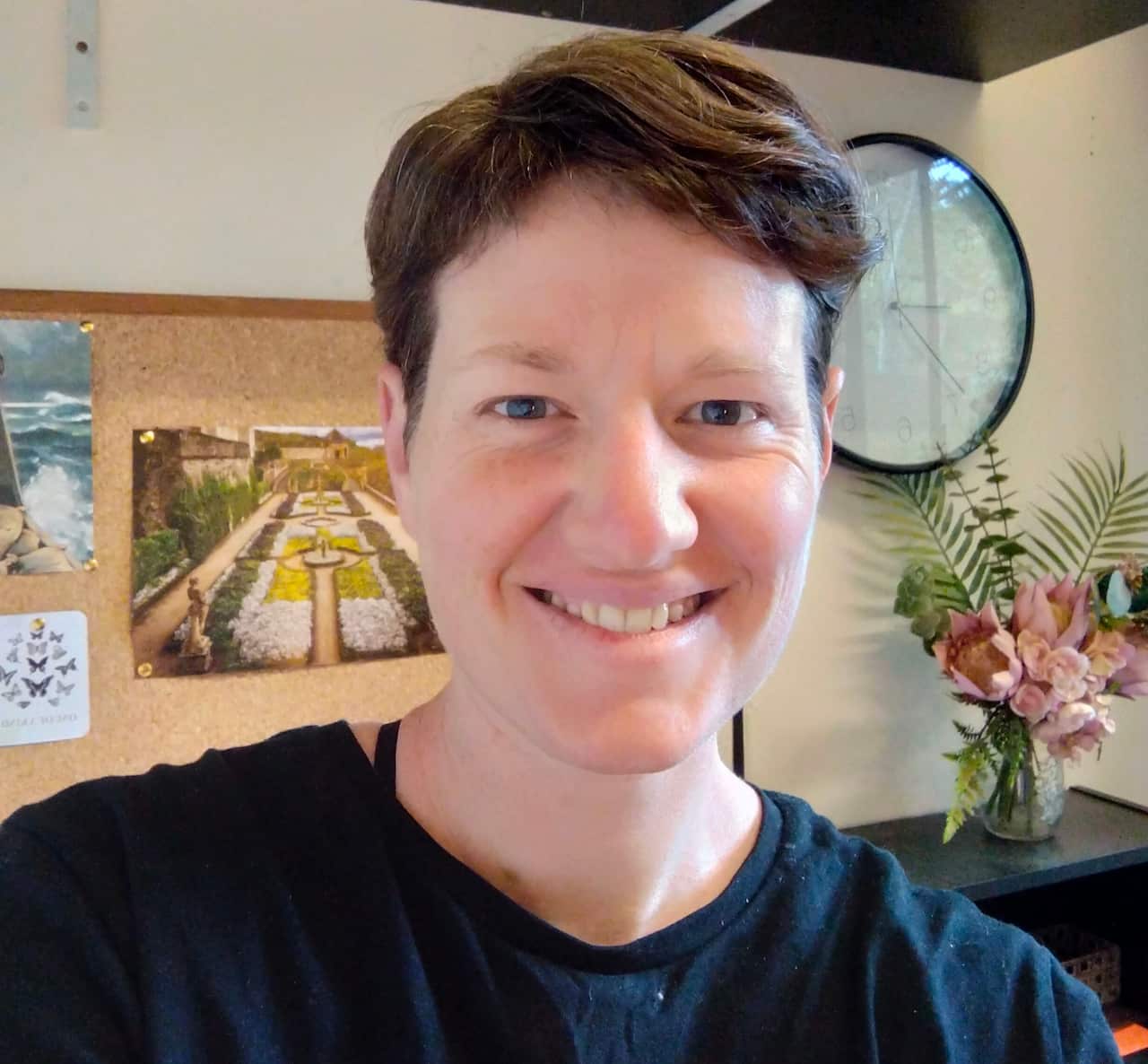 A woman taking a selfie and smiling