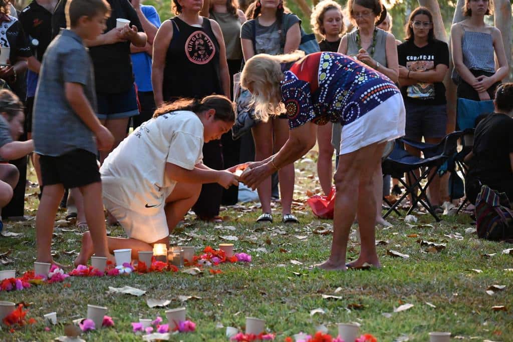 Lighting a path of candles in Darwin