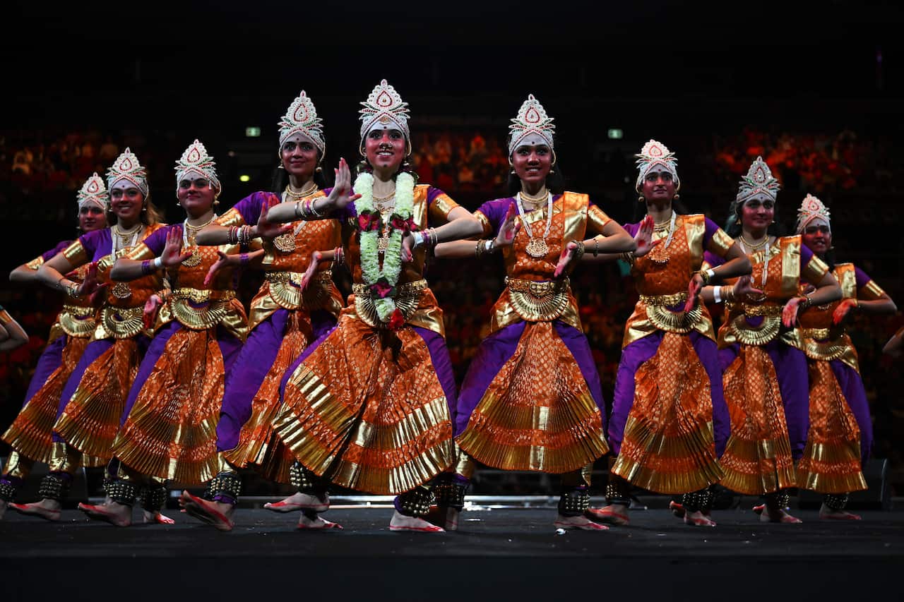 Dancers in elaborate costume on a stage
