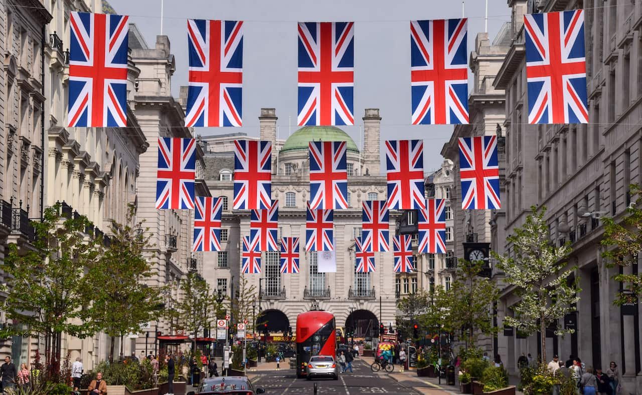 Union Jacks flags hanging above a street.
