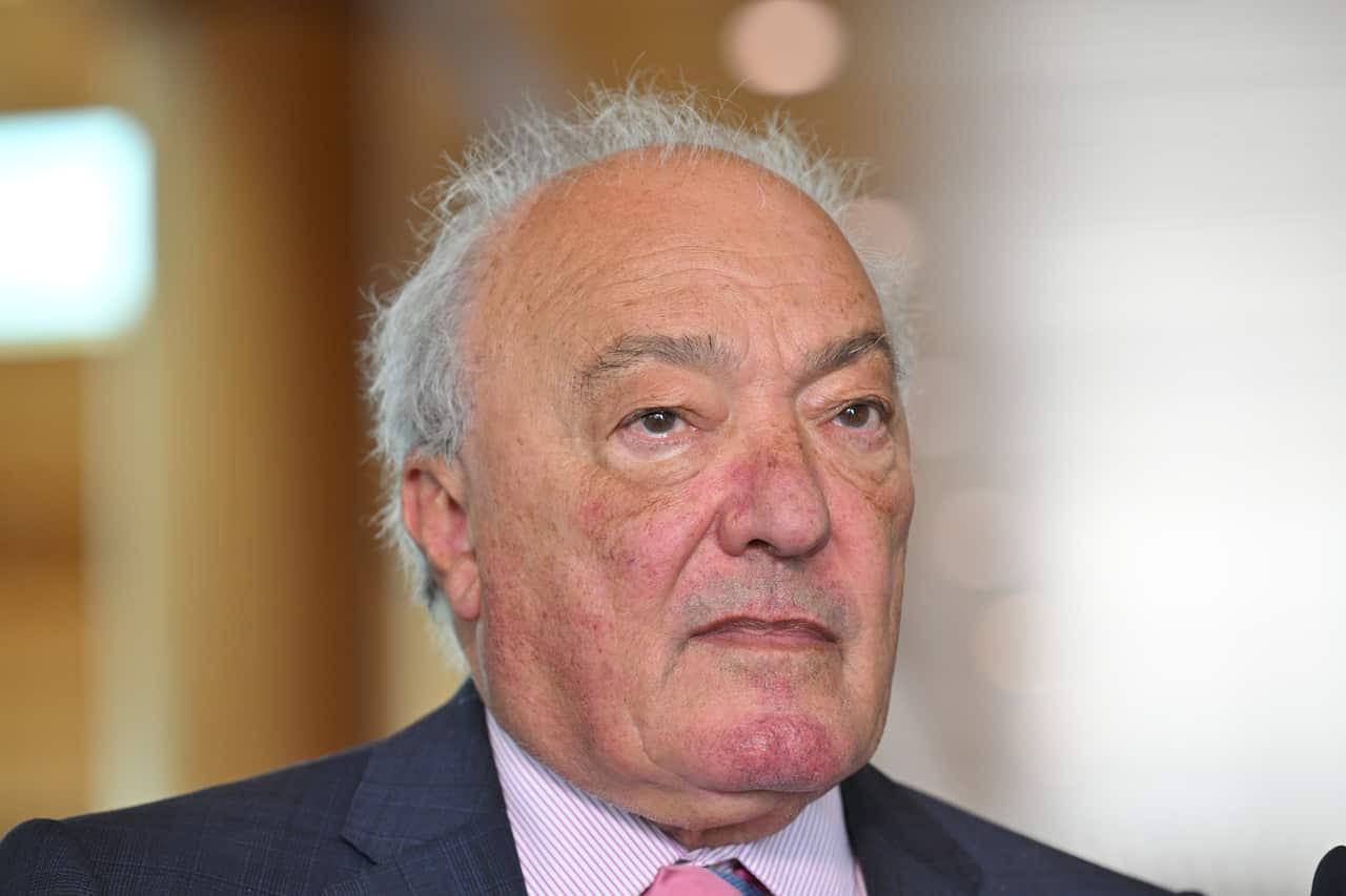 A close up of a man in a blue suit