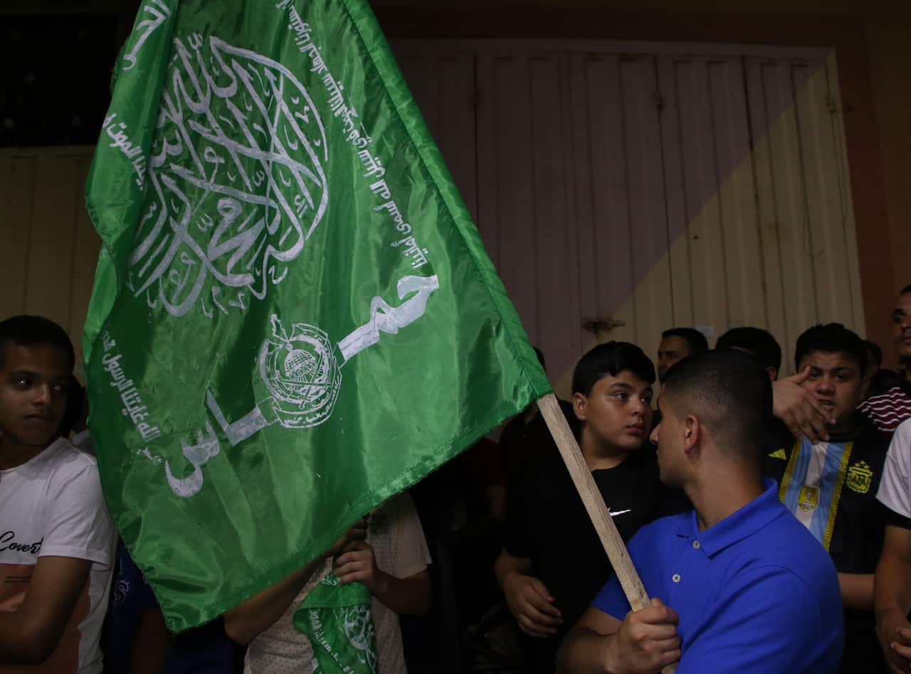 A green flag being held in Gaza.