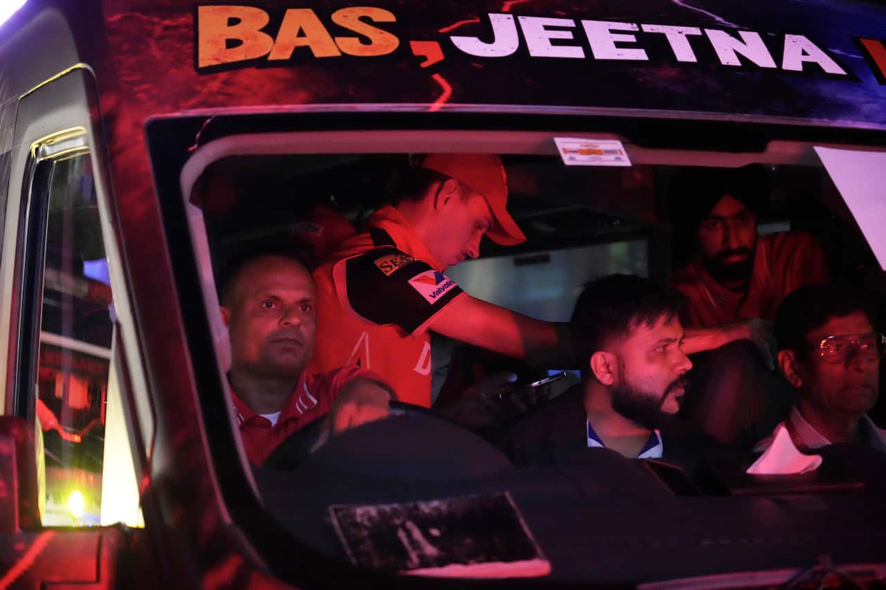 Cricket players inside a bus