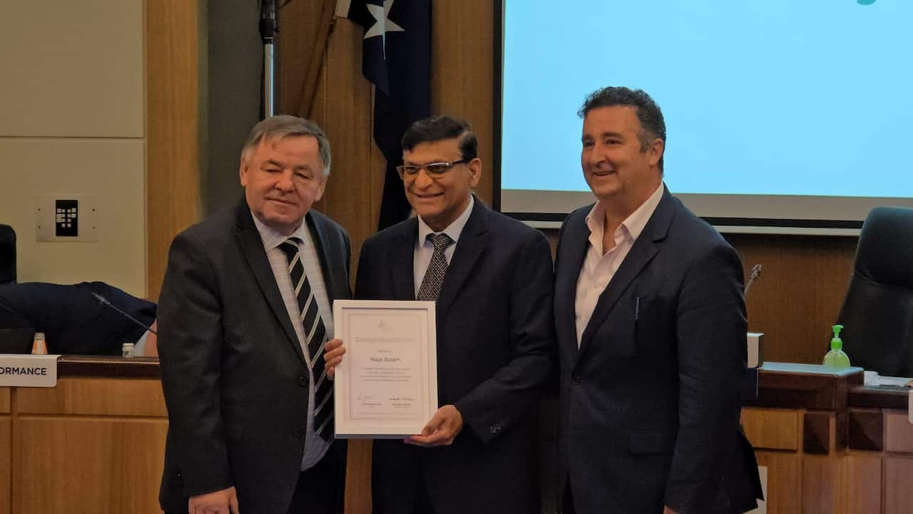 Raja Aslam is awarded by local council for his community work.jpeg