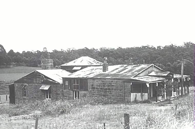A black and white photo of a house. 