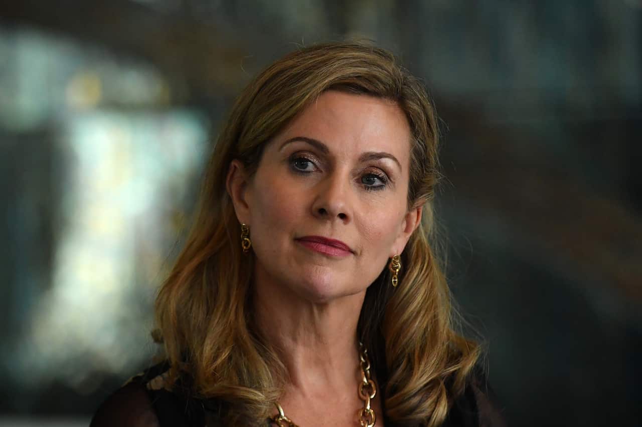 A woman in a dark top 