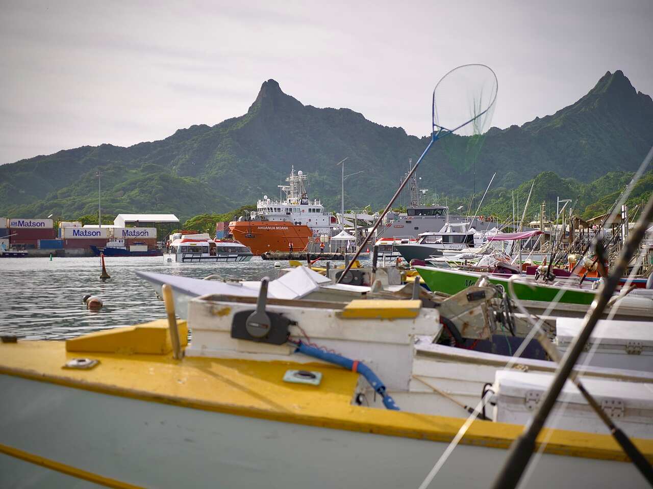 The Moana Minerals exploration ship (back) dwarfs fishboats at Avatiu Harbour, Cook Islands. 