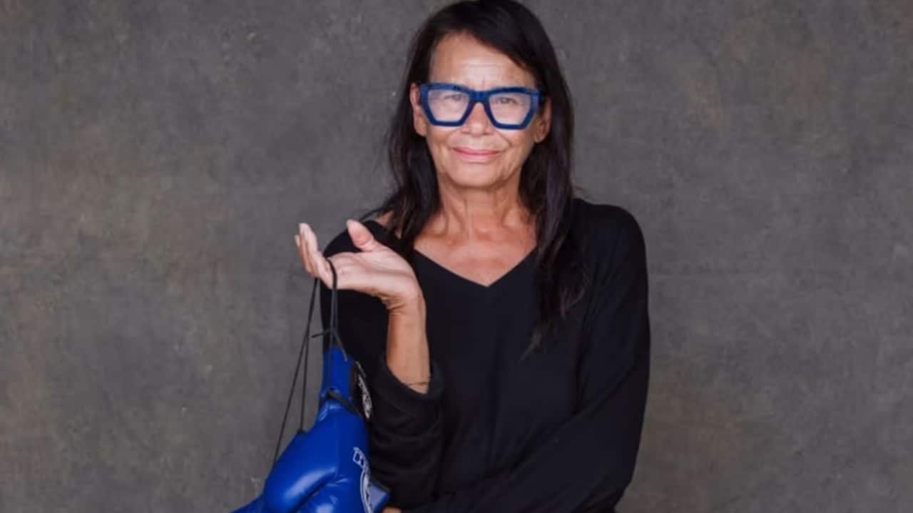 A woman smiling as she poses for a photo.